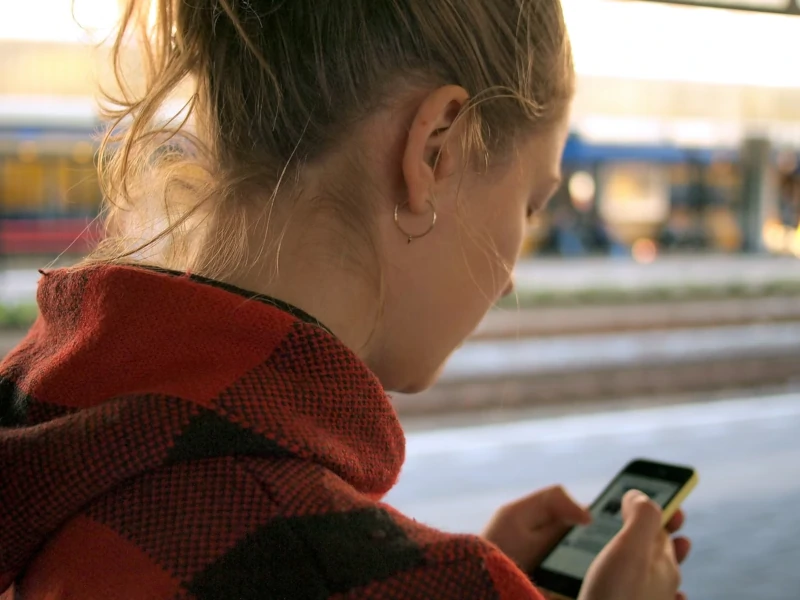 Woman looking at smartphone.